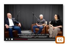 Screenshot of the ET Talk podcast with captioning on the video.