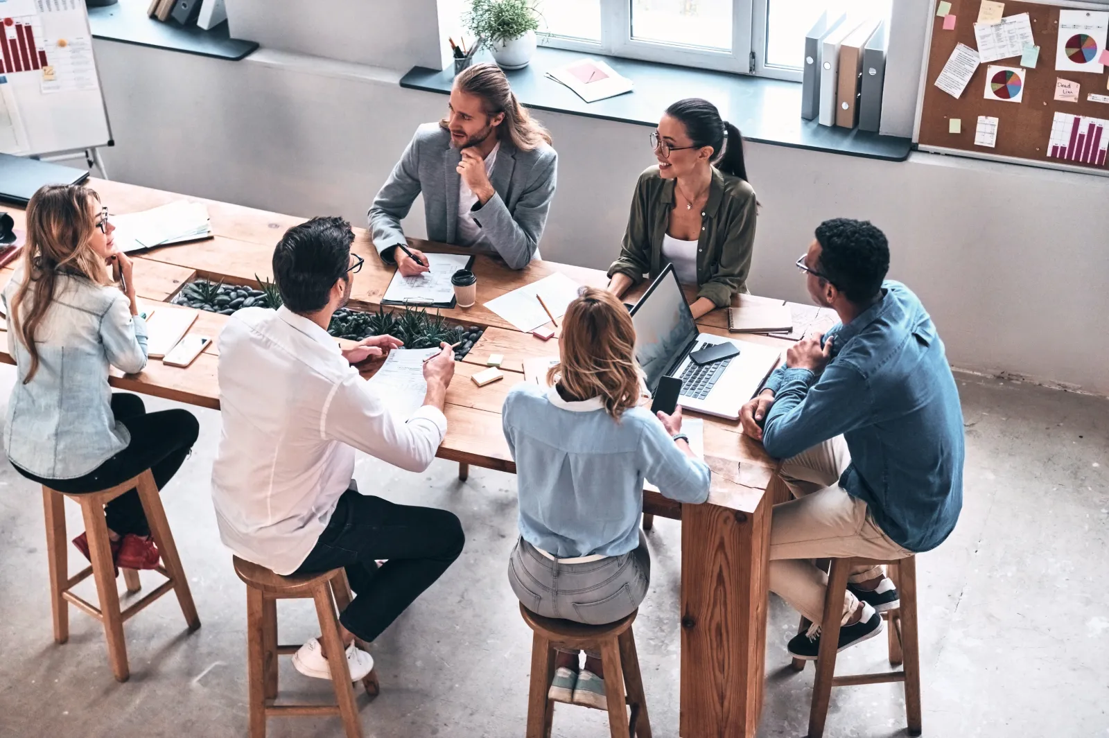 professionals at meeting table strategizing