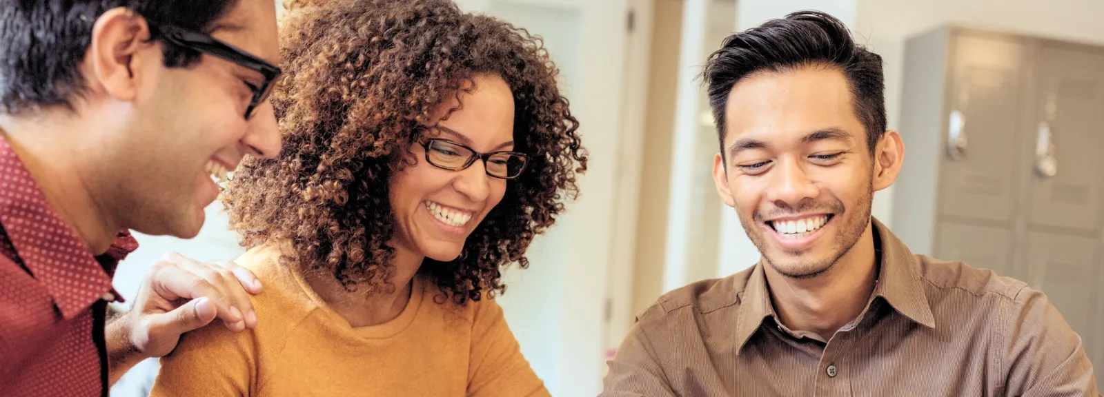 3 people smiling together