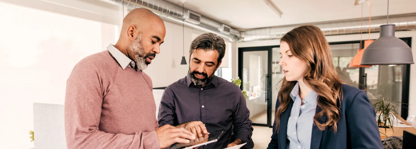 employees using an ipad in a discussion