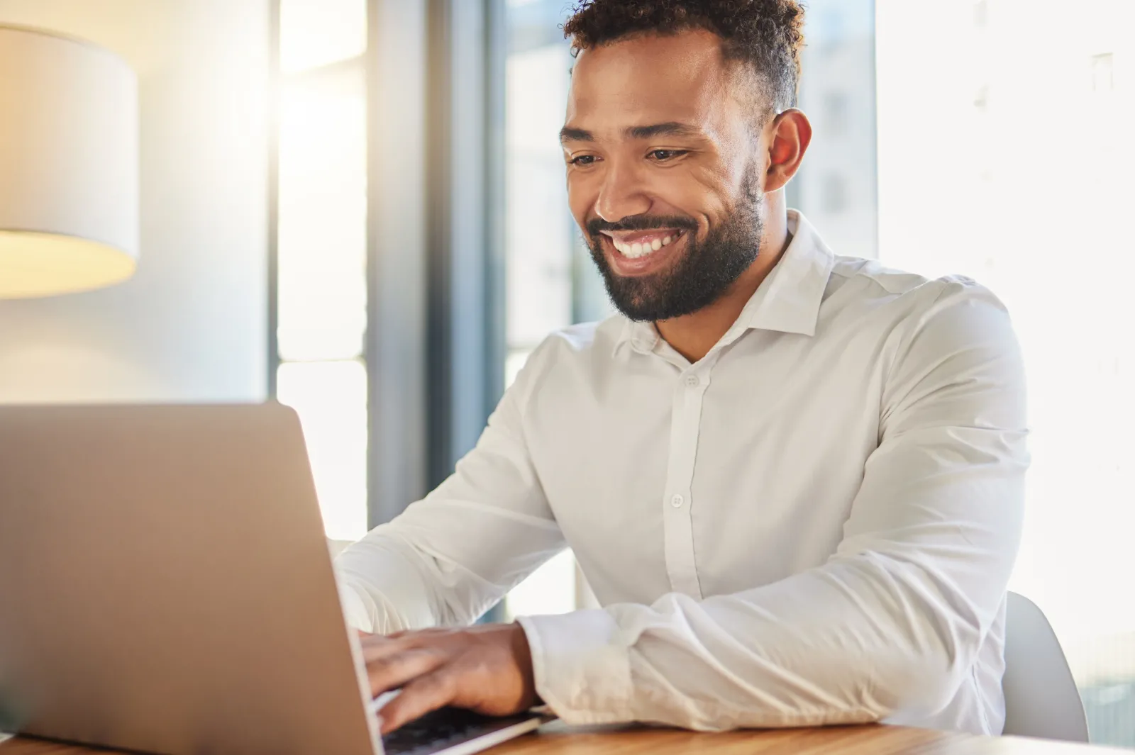 male working on laptop at a desk