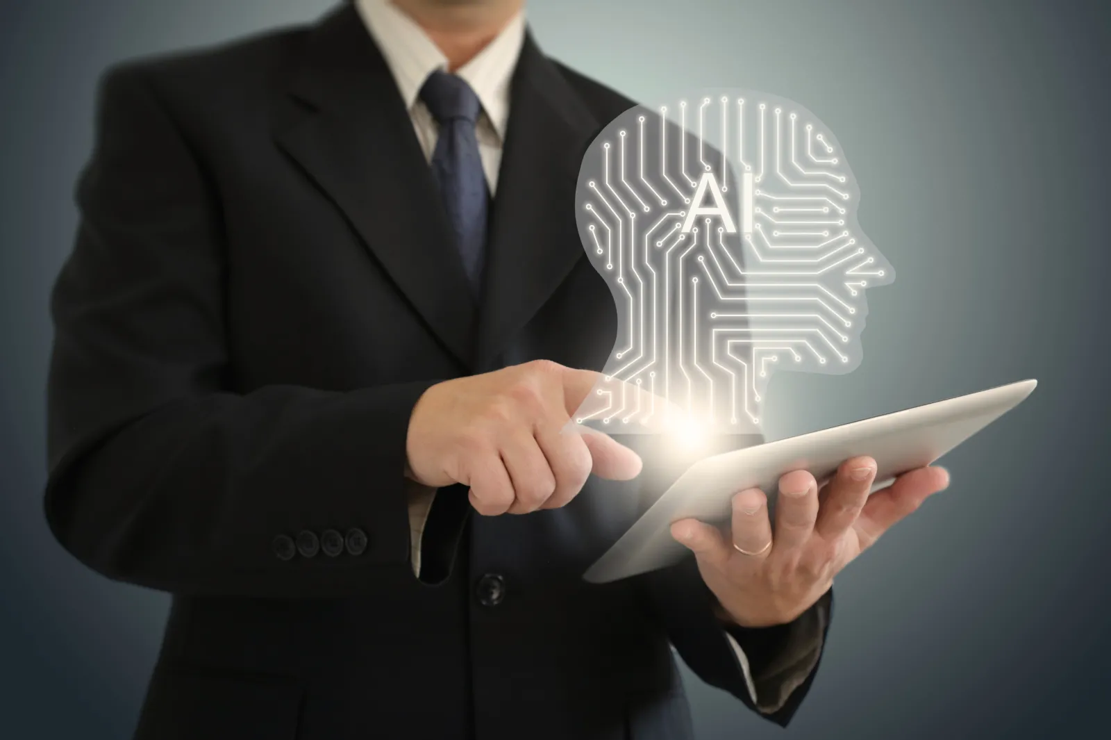 Person on an iPad with a digital AI graphic floating above the iPad.