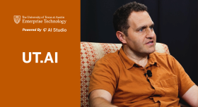 Image of a professor sitting in a chair. 