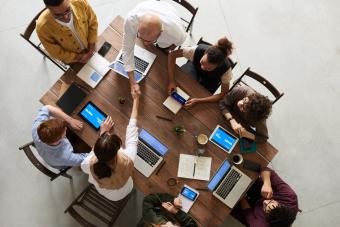 Meeting of people sitting around a table