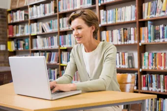 A female professor working on her computer