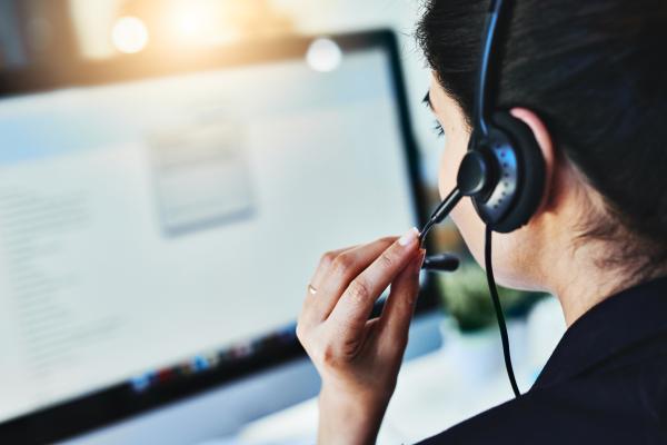Person with a headset providing support