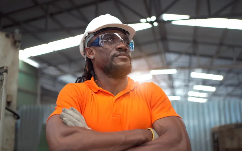 facilities worker with orange shirt