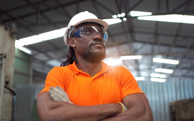 facilities worker with orange shirt