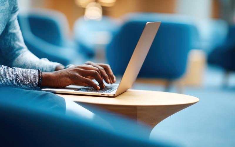 Person typing on a laptop